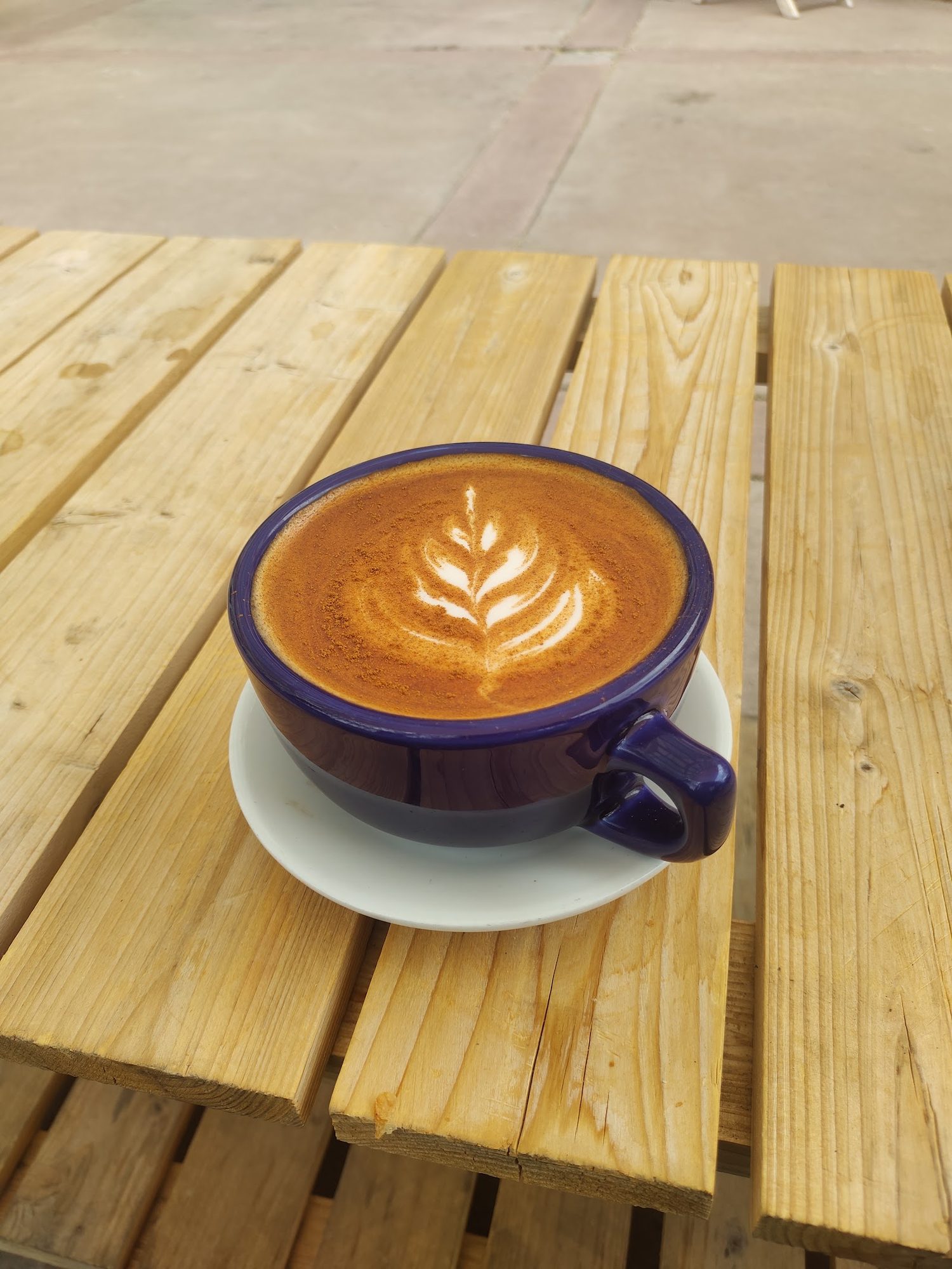 Latte with a rosetta poured into the foam